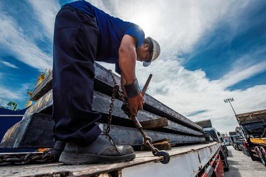 A worker is pictured securing cargo before heading out on a delivery.