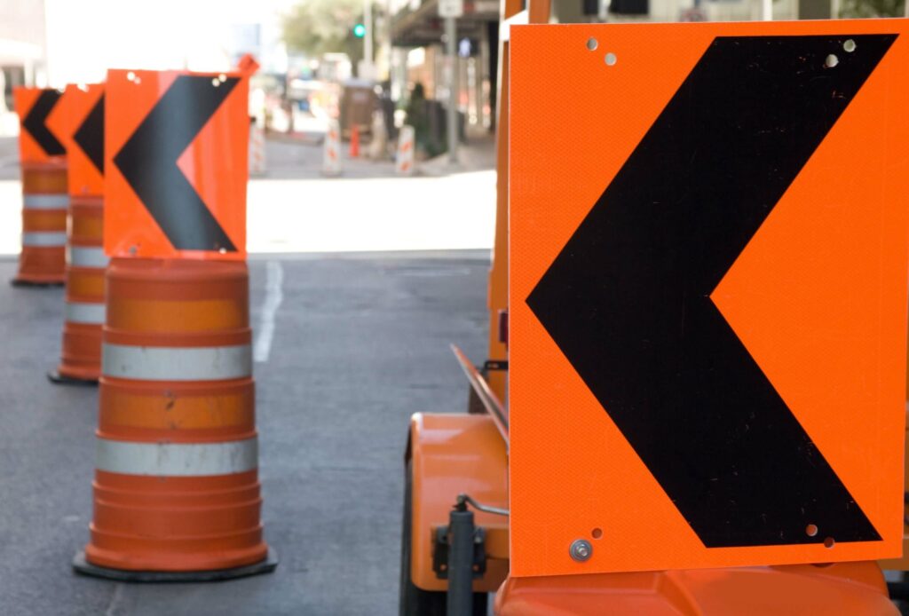 Arrows on barrels are used to direct traffic in this Houston work zone.