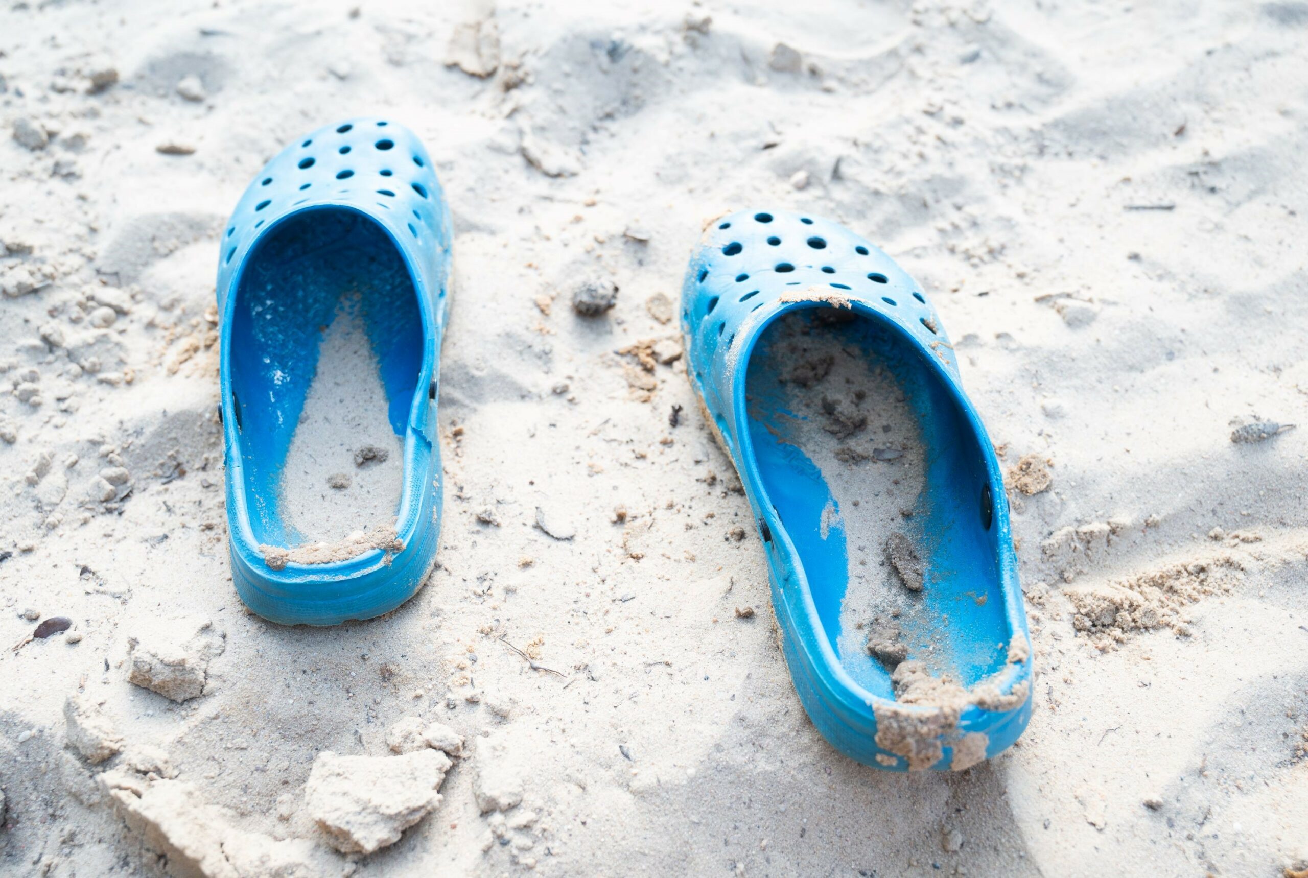 A pair of sand-filled blue flip-flops are pictured here as a way of illustration how you can leave a trail of sunshine.