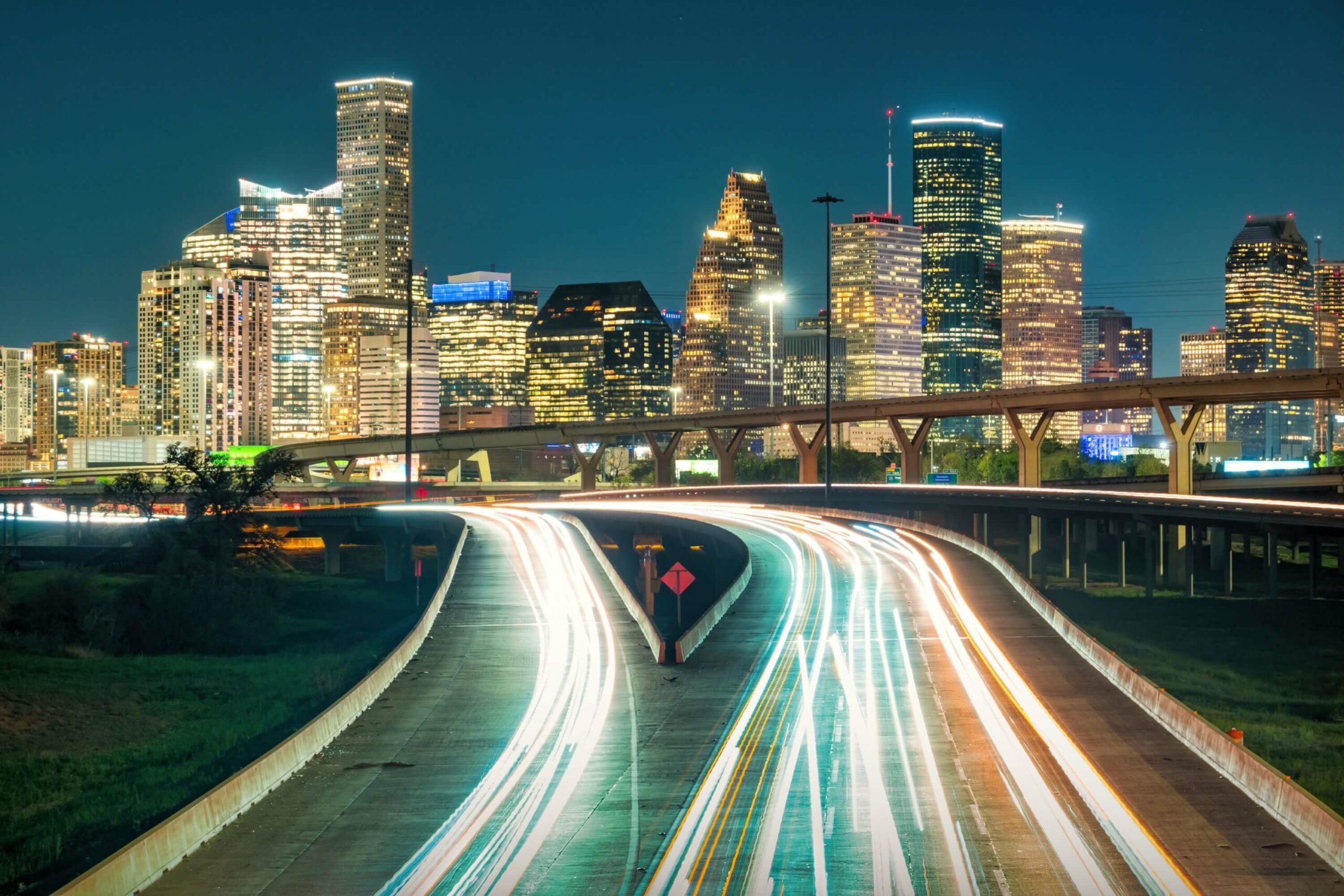 Vehicle traffic lights are blurred by speed on a highway outside of Houston.