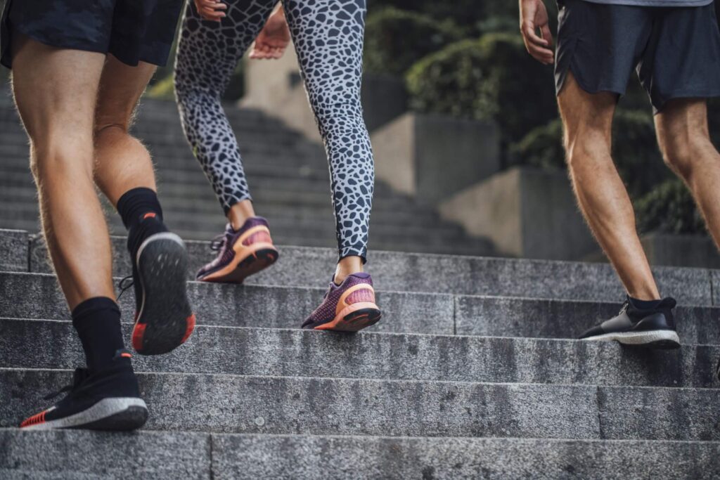 This is a photo of people walking up steps. A 30-minute walk can boost heart health, reduce stress and strengthen muscles and bones.