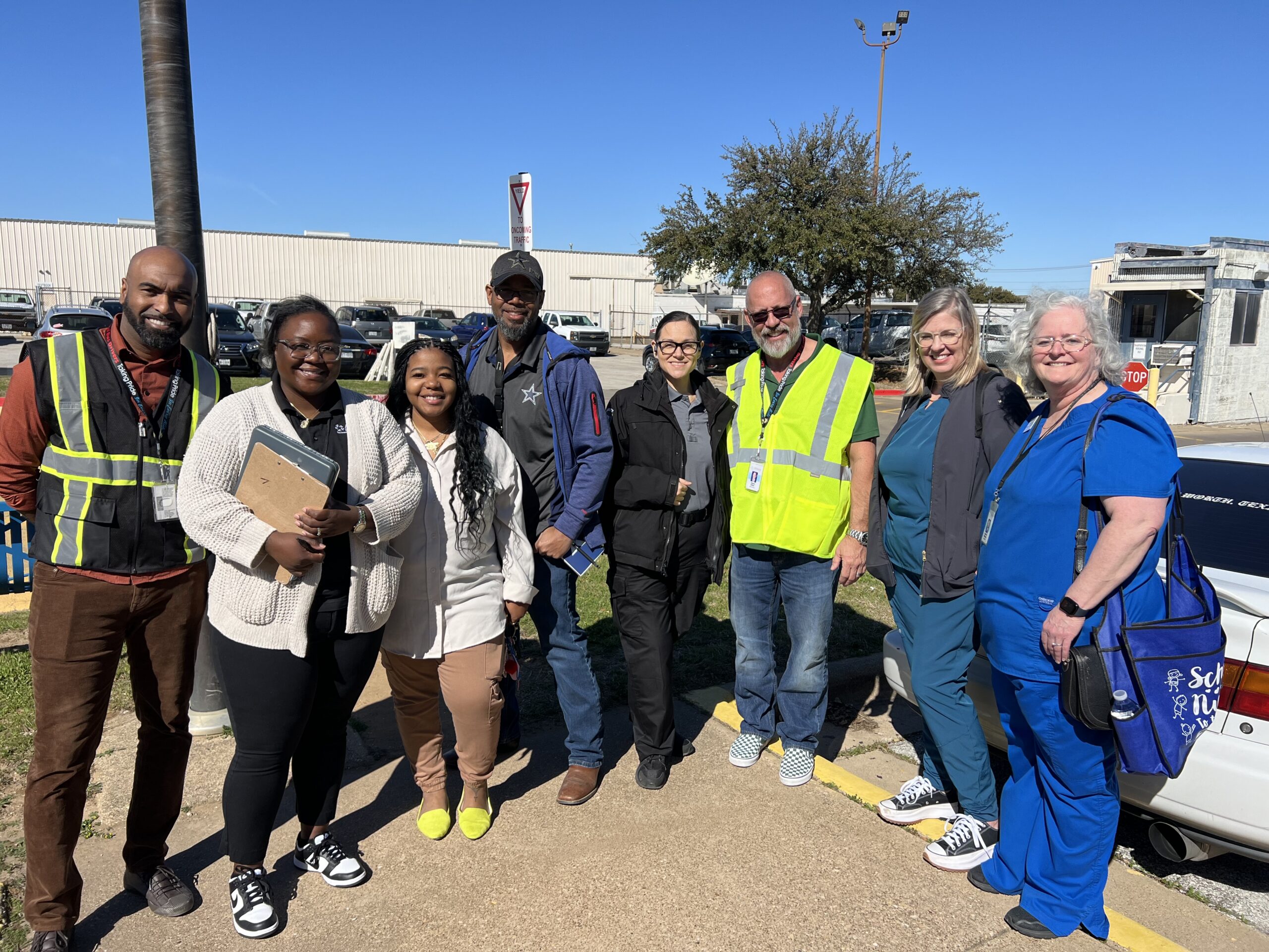 arlington-safety-walkthrough Arlington Independent School District safety leaders pose for a photograph after conducting a safety walkthrough at the bus dock.
